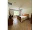 Bedroom features a large window and a classic wood sleigh bed at 18292 Hunters Meadow Walk, Land O Lakes, FL 34638