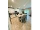 Open concept kitchen with island, granite countertops, stainless appliances, and adjacent dining area at 18292 Hunters Meadow Walk, Land O Lakes, FL 34638