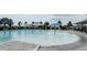 Large, inviting community pool with a splash fountain, shaded seating and ample deck space at 18292 Hunters Meadow Walk, Land O Lakes, FL 34638