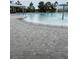 Community pool features a splash fountain and brick paving for recreation at 18292 Hunters Meadow Walk, Land O Lakes, FL 34638