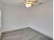 Empty bedroom features vinyl wood flooring and a ceiling fan at 1920 E Chelsea St, Tampa, FL 33610