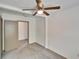 Bedroom with neutral walls, ceiling fan and doorway to another room at 1920 E Chelsea St, Tampa, FL 33610