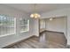Bright dining area with plenty of windows and updated flooring at 1920 E Chelsea St, Tampa, FL 33610