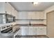 Clean kitchen with white cabinets and modern appliances at 1920 E Chelsea St, Tampa, FL 33610