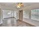 Open-concept living room boasts updated flooring, neutral paint, and an abundance of natural light at 1920 E Chelsea St, Tampa, FL 33610