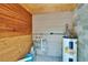 Utility room features a water heater and wood paneling at 1920 E Chelsea St, Tampa, FL 33610