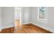 Bedroom features hardwood floors, white walls, and natural light at 2015 3Rd S St, St Petersburg, FL 33705