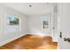 Bright bedroom features hardwood floors, white walls, and natural light at 2015 3Rd S St, St Petersburg, FL 33705
