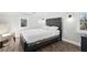 Bright bedroom featuring wood floors, a comfortable queen bed and a cozy accent chair at 2015 3Rd S St, St Petersburg, FL 33705