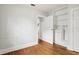 Bright bedroom features hardwood floors, white walls, and closet space at 2015 3Rd S St, St Petersburg, FL 33705