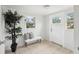 Bright entryway with tile flooring, a cozy bench, and natural light from surrounding windows at 2015 3Rd S St, St Petersburg, FL 33705