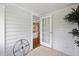 Stylish entryway featuring tile floors, white-painted wood-paneled walls, and a charming glass-paneled door at 2015 3Rd S St, St Petersburg, FL 33705