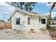 Charming home exterior featuring white siding, cute windows, and mature landscaping at 2015 3Rd S St, St Petersburg, FL 33705