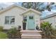 Charming home with a neatly landscaped front yard and inviting light blue front door at 2015 3Rd S St, St Petersburg, FL 33705