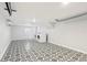 Large garage featuring washer and dryer, decorative tile floor and lots of room for storage at 2015 3Rd S St, St Petersburg, FL 33705