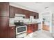 Updated kitchen features stainless steel appliances, granite countertops, and white subway tile backsplash at 2015 3Rd S St, St Petersburg, FL 33705