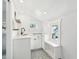 Charming white kitchenette featuring modern appliances, ample countertop space, and recessed lighting at 2015 3Rd S St, St Petersburg, FL 33705