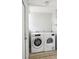 Bright laundry room features a stacked washer and dryer for added convenience at 2015 3Rd S St, St Petersburg, FL 33705