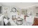 Bright living room featuring a brick fireplace, hardwood floors, and comfortable seating area at 2015 3Rd S St, St Petersburg, FL 33705