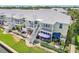 Back of townhome offering open-air decks and outdoor lounging areas with manicured yard and walkways at 219 Pompano Se Dr # C, St Petersburg, FL 33705