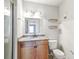 Well-lit bathroom featuring a granite countertop, modern fixtures, and a walk-in shower at 219 Pompano Se Dr # C, St Petersburg, FL 33705