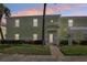 Charming condo featuring a private entrance, lush landscaping, and quaint architectural details at 219 Pompano Se Dr # C, St Petersburg, FL 33705