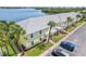 Charming yellow condo with well-manicured lawn, mature palm trees, and convenient parking at 219 Pompano Se Dr # C, St Petersburg, FL 33705