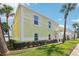Charming yellow condo with well-manicured lawn and beautiful hedge at 219 Pompano Se Dr # C, St Petersburg, FL 33705