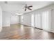 Spacious living room boasts updated flooring, ceiling fan, and ample natural light at 219 Pompano Se Dr # C, St Petersburg, FL 33705