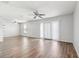 Spacious living room boasts updated flooring, ceiling fan, and ample natural light at 219 Pompano Se Dr # C, St Petersburg, FL 33705