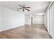 Spacious living room boasts updated flooring, ceiling fan, and ample natural light at 219 Pompano Se Dr # C, St Petersburg, FL 33705