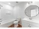 Clean bathroom features a shower-tub combo, wood-look floors, a toilet, and a modern vanity at 2313 Palm Ave, Seffner, FL 33584