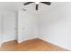 Clean bedroom with hardwood flooring, ceiling fan, and two closets at 2313 Palm Ave, Seffner, FL 33584