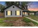 Charming single-story home featuring black shutters and neutral siding, complemented by a landscaped yard at 2313 Palm Ave, Seffner, FL 33584