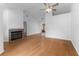 Spacious living area with hardwood floors, a brick fireplace, and ample natural light at 2313 Palm Ave, Seffner, FL 33584