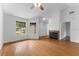 Bright living room with hardwood floors, fireplace, and large windows at 2313 Palm Ave, Seffner, FL 33584