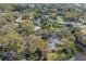 Stunning aerial reveals the home's unique location nestled among trees near a peaceful canal, promising tranquility at 2416 S 46Th St, Tampa, FL 33619