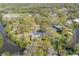 The property is located on a picturesque canal surrounded by established trees, creating an idyllic waterfront setting at 2416 S 46Th St, Tampa, FL 33619
