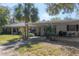 A cozy single story home with a covered patio provides a welcoming outdoor space with ample light at 2416 S 46Th St, Tampa, FL 33619