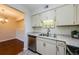 Well-equipped kitchen with stainless appliances and views to dining area at 2690 Coral Landings Blvd # 722, Palm Harbor, FL 34684