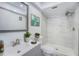 Bright bathroom features marble shower, tile floors, and modern fixtures at 2770 Keats Ter # C, Palm Harbor, FL 34684