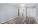 Light-filled bedroom features updated floors and an ensuite bathroom at 2770 Keats Ter # C, Palm Harbor, FL 34684