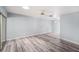 Spacious bedroom featuring gray vinyl plank flooring, neutral walls and ceiling fan, offering a serene retreat at 2770 Keats Ter # C, Palm Harbor, FL 34684