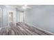 Expansive bedroom featuring updated floors, an ensuite bathroom, and closet space at 2770 Keats Ter # C, Palm Harbor, FL 34684