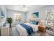 Inviting bedroom featuring a comfortable bed, stylish decor, and ample natural light at 2770 Keats Ter # C, Palm Harbor, FL 34684
