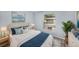 Relaxing bedroom featuring a comfortable bed, natural light, and stylish decor at 2770 Keats Ter # C, Palm Harbor, FL 34684