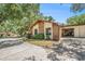 Home's exterior showcases natural stone accents and an attached garage at 2770 Keats Ter # C, Palm Harbor, FL 34684