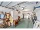A cluttered garage interior showcasing storage and potential workspace at 2770 Keats Ter # C, Palm Harbor, FL 34684