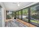 Open sunroom featuring neutral paint, plenty of windows providing an abundance of natural light and outdoor views at 2770 Keats Ter # C, Palm Harbor, FL 34684
