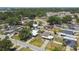 An overhead shot showcases a quaint home with lush tree coverage in a serene residential area at 2830 Anthony St, Tampa, FL 33619
